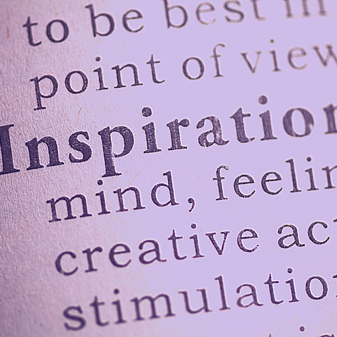Newspaper print with the words Inspiration, Creative Action, Stimulation